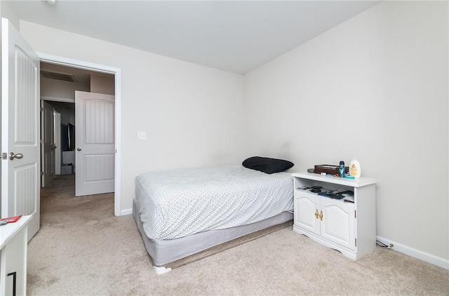 bedroom with light carpet