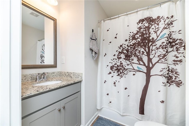 bathroom with vanity and a shower with curtain