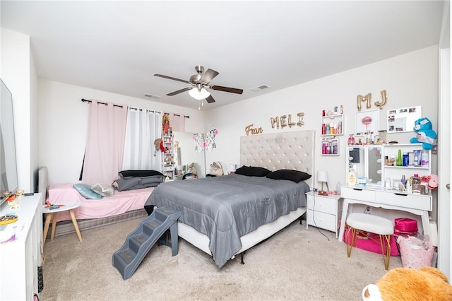 carpeted bedroom featuring ceiling fan