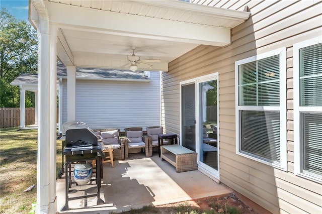 view of patio featuring ceiling fan and a grill