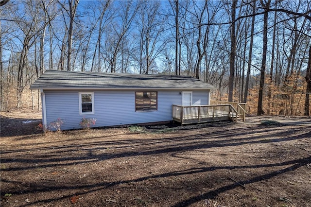 view of home's exterior with a wooden deck