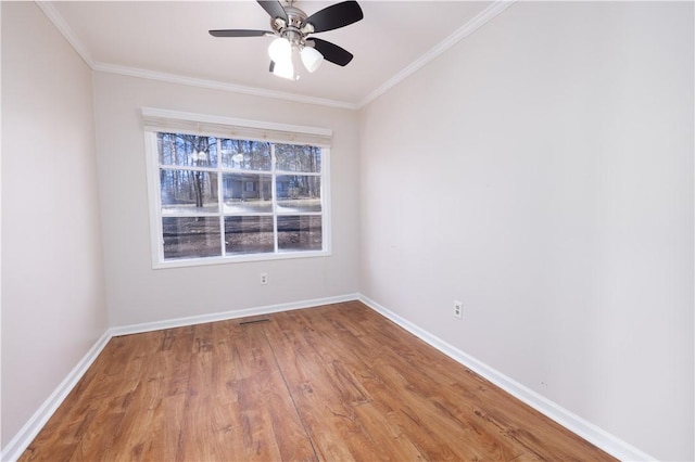 spare room featuring ceiling fan, ornamental molding, and hardwood / wood-style floors