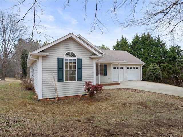 view of front of property with a front yard and a garage