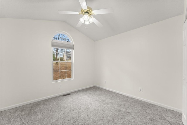 unfurnished room featuring ceiling fan, lofted ceiling, and carpet floors