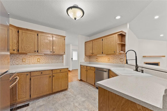 kitchen with sink, backsplash, dishwasher, and kitchen peninsula