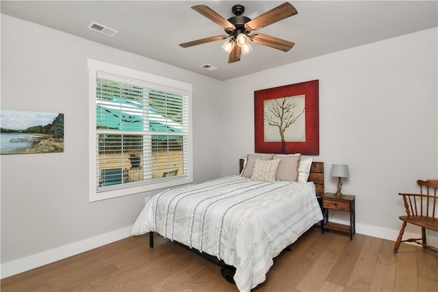 bedroom featuring ceiling fan and wood-type flooring