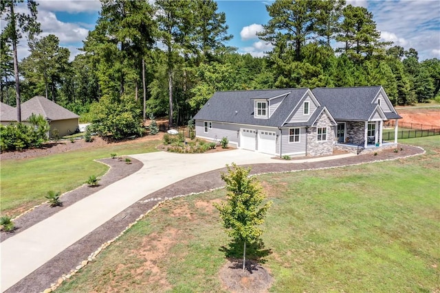 view of front of home with a garage and a front yard