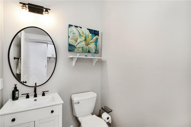 bathroom with toilet and vanity