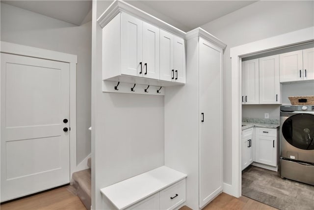 mudroom featuring light hardwood / wood-style flooring and washer / clothes dryer