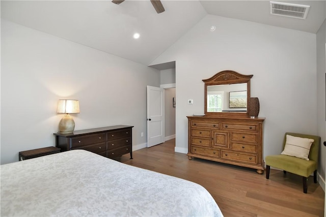 bedroom featuring ceiling fan, dark wood-type flooring, and high vaulted ceiling