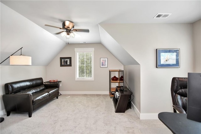 sitting room featuring light carpet, ceiling fan, and vaulted ceiling