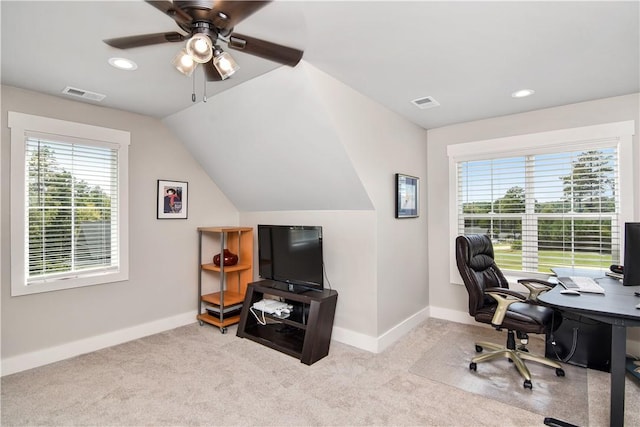 carpeted home office featuring vaulted ceiling and ceiling fan