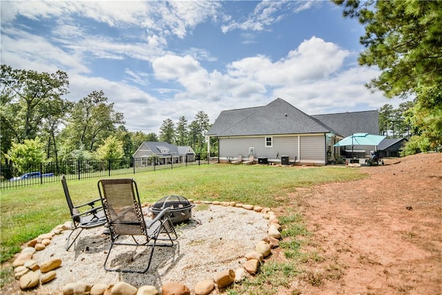 view of yard featuring an outdoor fire pit