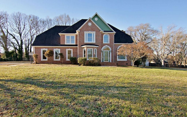 front facade with a front yard