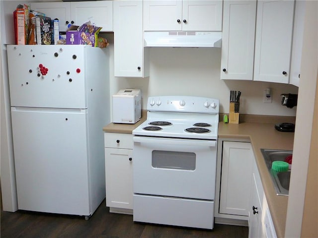 kitchen featuring sink, white appliances, and white cabinetry