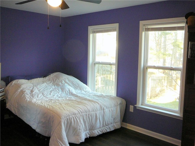 bedroom featuring ceiling fan and dark hardwood / wood-style flooring