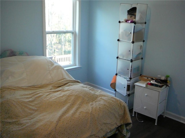 bedroom featuring dark wood-type flooring