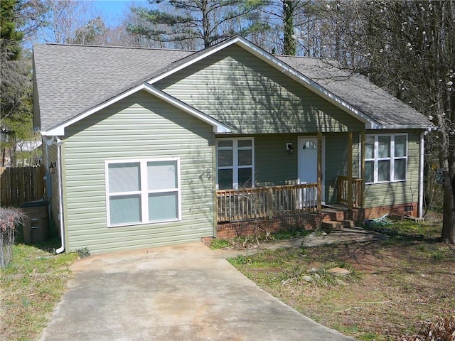 view of front of property featuring a porch and a shingled roof