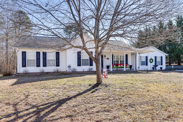 ranch-style home featuring a front yard