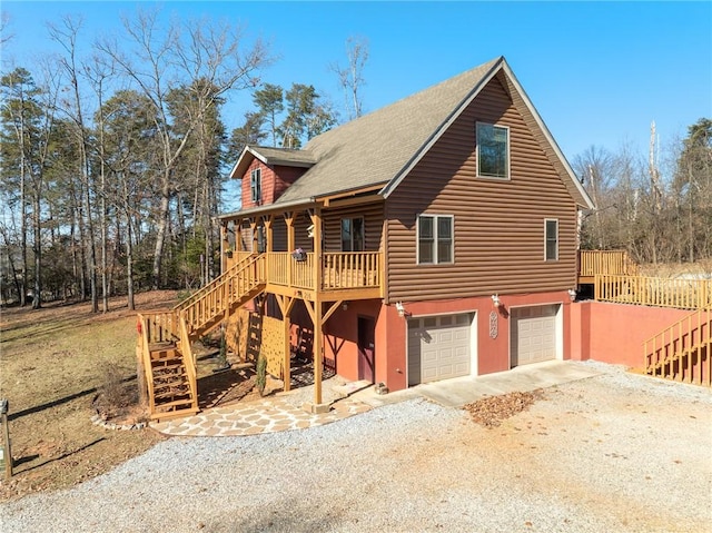 view of front of home featuring covered porch and a garage