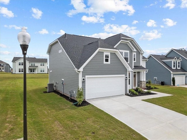 craftsman inspired home with a garage, a front lawn, and central air condition unit