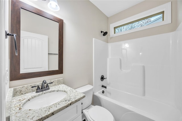 full bathroom with toilet, vanity, and  shower combination