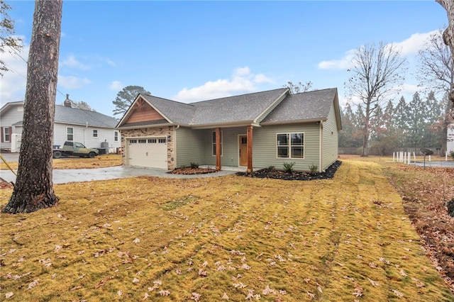 view of front of house featuring a garage and a front yard