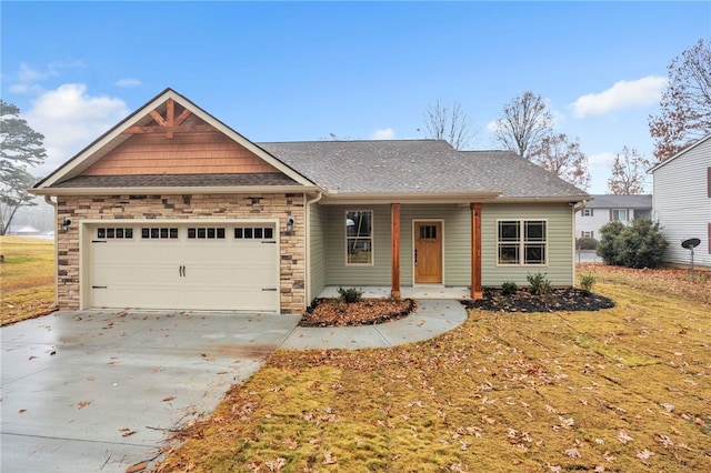 view of front of house featuring a front yard and a garage