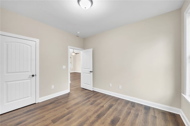 unfurnished bedroom featuring dark hardwood / wood-style flooring