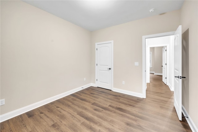 unfurnished bedroom featuring wood-type flooring