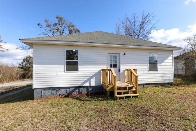 rear view of house with a lawn