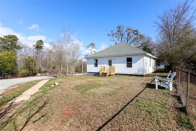 back of house featuring a yard