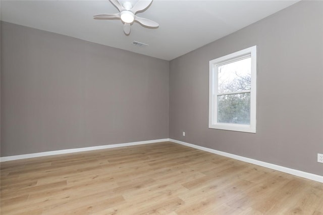 unfurnished room featuring ceiling fan and light hardwood / wood-style flooring