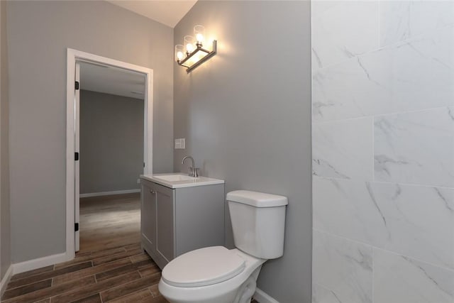 bathroom featuring toilet and vanity