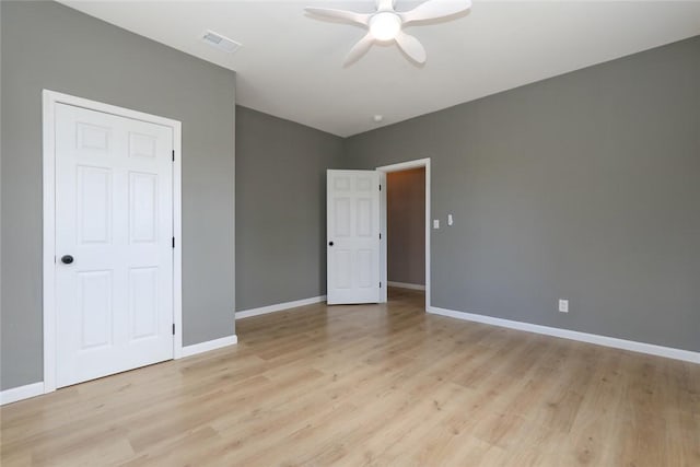 unfurnished bedroom with ceiling fan and light hardwood / wood-style flooring