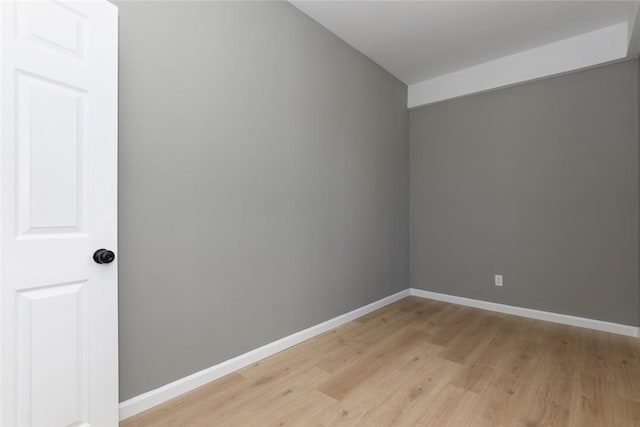 unfurnished room featuring light wood-type flooring