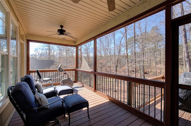 wooden terrace featuring ceiling fan