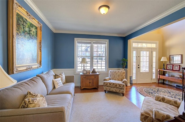 living room featuring hardwood / wood-style flooring and crown molding