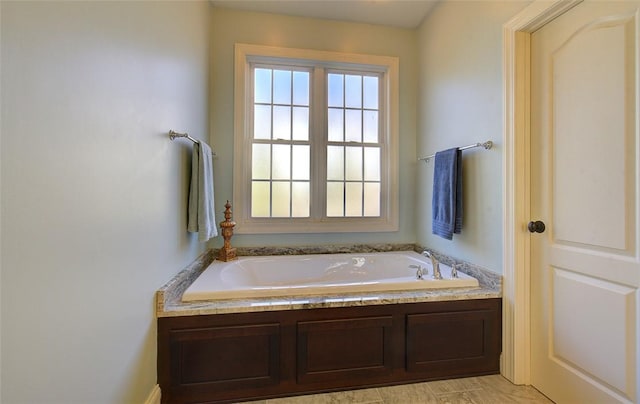 bathroom featuring a tub to relax in