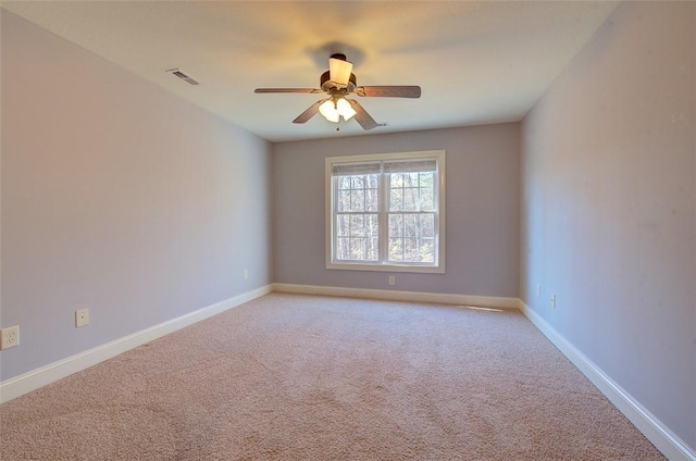 carpeted empty room with ceiling fan