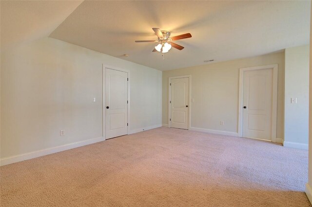 spare room with light carpet and ceiling fan