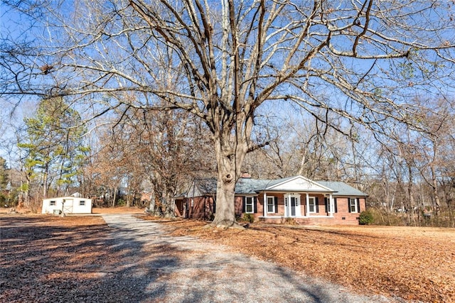 ranch-style home with a porch