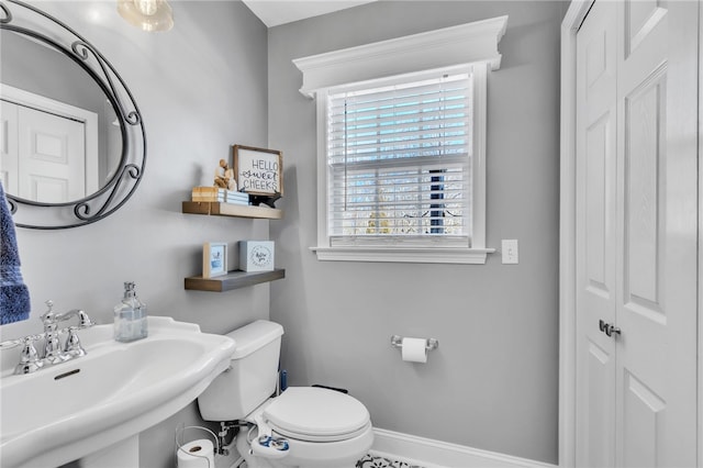 bathroom featuring sink and toilet