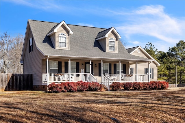 view of front facade with a front lawn and a porch