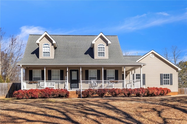 view of front of house featuring a porch and a front lawn