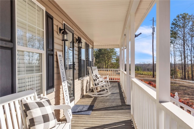 wooden terrace with a porch