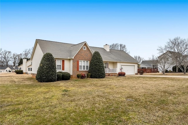 view of front of house with a front yard and a garage