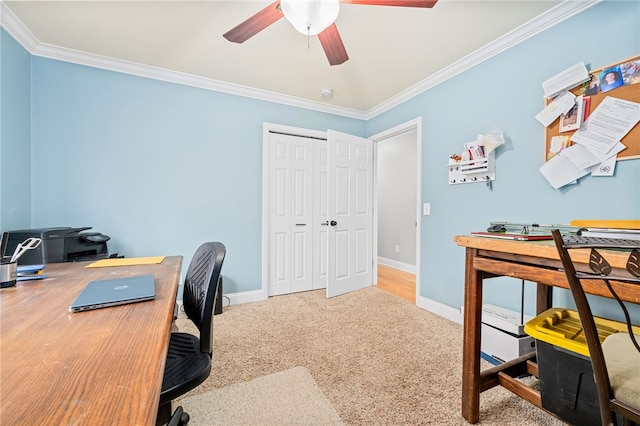 carpeted office space with ornamental molding and ceiling fan