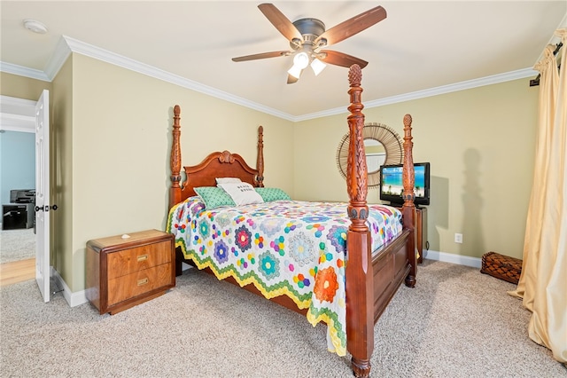 carpeted bedroom featuring crown molding and ceiling fan