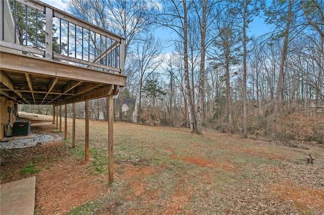 view of yard featuring central AC unit and a deck